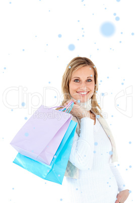 Composite image of handsome woman holding shopping bags against