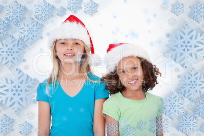 Composite image of girls with christmas hats