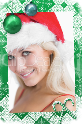 Composite image of pretty woman wearing stanta hat