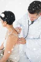 Composite image of doctor using stethoscope on back of woman