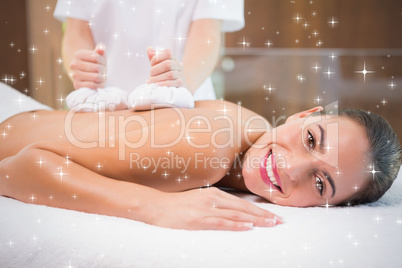 Attractive woman receiving treatment at spa center
