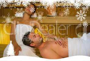 Loving couple relaxing in a sauna