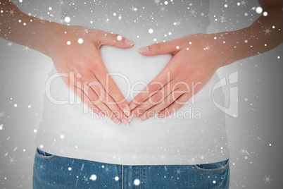 Mid section of a casual woman with stomach pain