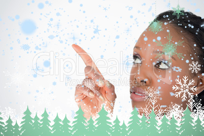 Close up of woman pointing at something next to her on a white background