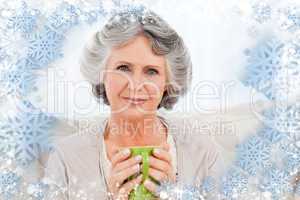 Composite image of senior drinking a cup of tea