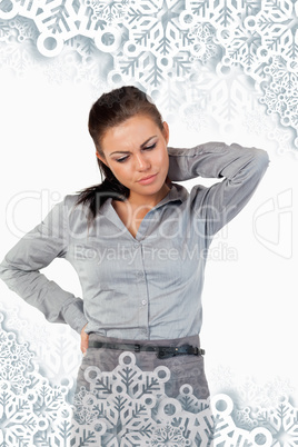 Portrait of a depressed businesswoman having back pain