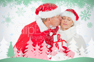 Festive couple smiling and holding gift