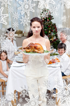 Mother showing turkey for christmas dinner