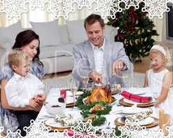 Father cutting a turkey in christmas dinner