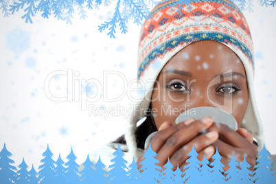 Student woman enjoying a cup of tea in the cold