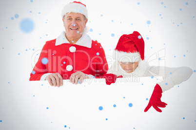 Composite image of festive older couple