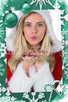 Composite image of pretty girl in santa outfit blowing