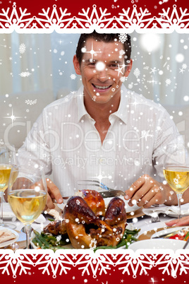 Smiling man eating turkey in christmas dinner