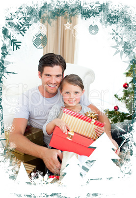 Happy little girl with her father holding a christmas gift