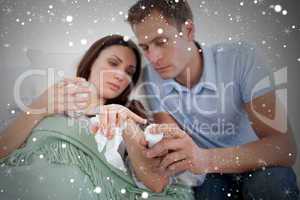 Composite image of attentive husband looking after his wife