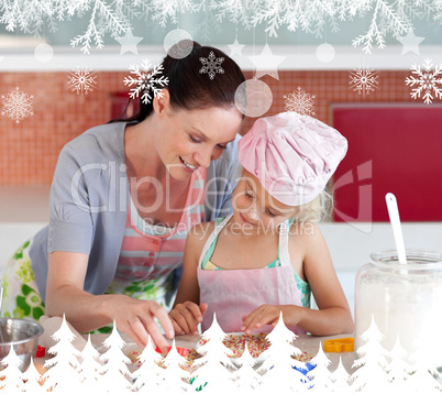 Delighted mother and her daughter baking in a kitchen