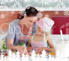 Delighted mother and her daughter baking in a kitchen
