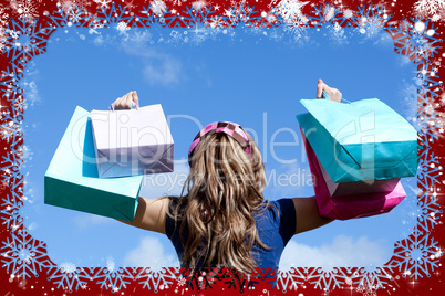 Young woman holding shopping bags outdoor