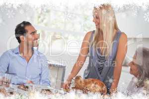 Composite image of happy wife bringing turkey to the table