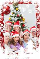 Composite image of happy family at christmas