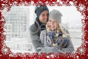 Cute couple in warm clothing smiling at camera