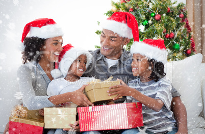 Composite image of family celebrating christmas at home