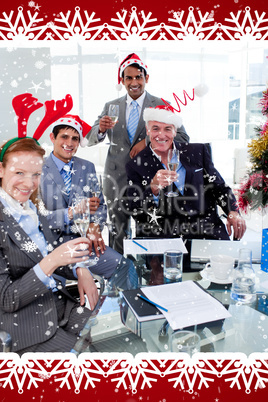 Manager and his team toasting with champagne at a christmas part