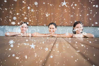 Cheerful young women in swimming pool
