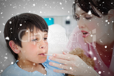 Composite image of caring nurse taking her patients temperature