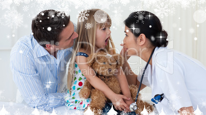 Composite image of doctor examining childs throat