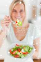 Smiling woman offering a salad