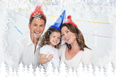 Portrait of cute little girl with her parents during a birthday