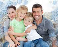 Adorable family sitting on the sofa and smiling