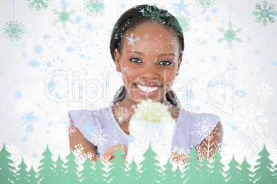 Close up of woman holding a present against a white background