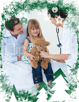 Female doctor and happy little girl examing a teddy bear