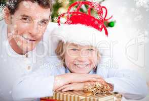 Composite image of bright father celebrating christmas with his