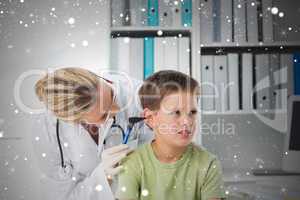 Composite image of boy being examined by pediatrician