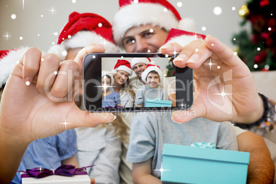 Hand holding smartphone showing photo