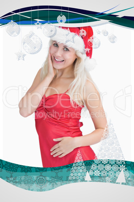 Composite image of excited woman wearing santa hat