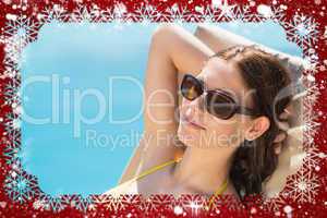 Composite image of cheerful woman by swimming pool