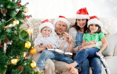 Portrait of a family at christmas on the sofa