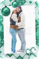 Composite image of attractive young couple in warm clothes huggi