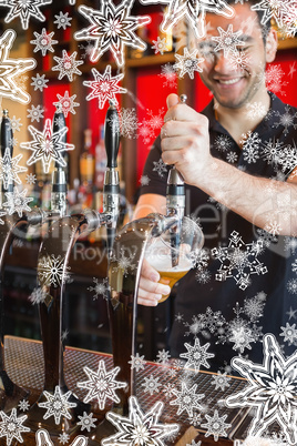 Composite image of handsome barkeeper pulling a pint of beer