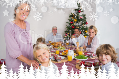 Composite image of grandmother and granddaughter standing beside