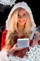 Pretty blonde in santa outfit opening gift