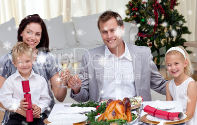 Parents toasting with wine in christmas dinner