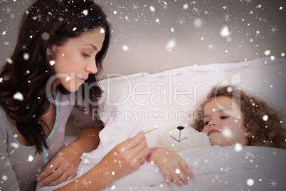 Composite image of mother taking her daughters temperature