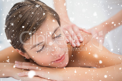 Attractive woman receiving back massage at spa center