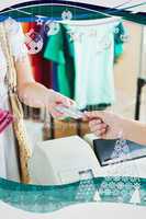 Close up of a cute woman paying with her credit card