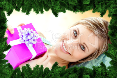 Smiling woman holding a present Smiling woman holding a present